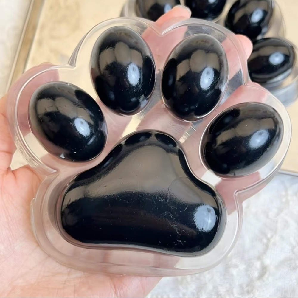 Extra large cat paw squishy in black. Stress relief Taba ball